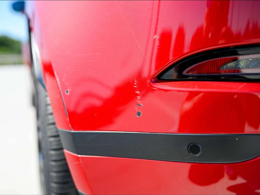 Range Rover Evoque P300e S — Achterbumper rechts — kleine lakschade